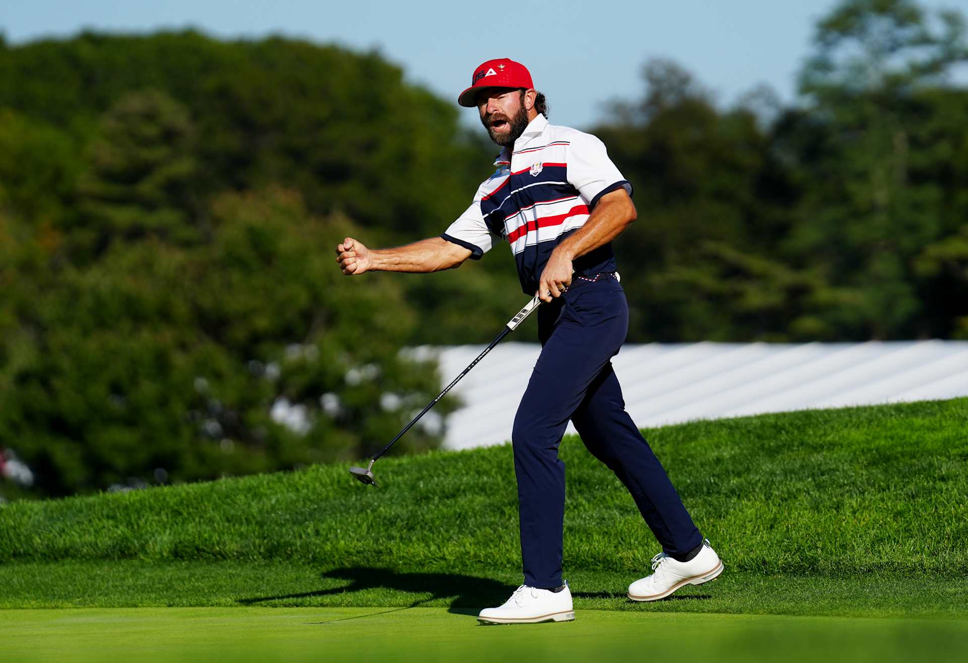 FARMINGDALE, NEW YORK - SEPTEMBER 28: Cameron Young of Team United States celebrates after making a putt to defeat Justin Rose (Not Pictured) of Team Europe 1UP on the 18th hole against during the Sunday singles matches of the 2025 Ryder Cup at Black Course at Bethpage State Park Golf Course on September 28, 2025 in Farmingdale, New York. (Photo by Mike Stobe/Getty Images)