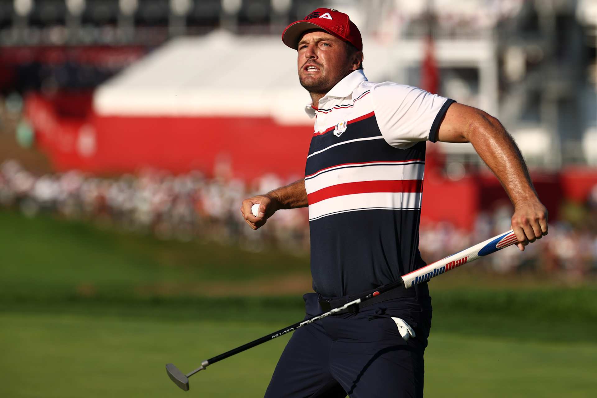 FARMINGDALE, NEW YORK - SEPTEMBER 28: Bryson DeChambeau of Team United States reacts on the 18th green after making his putt to halve the match with Matt Fitzpatrick (Not Pictured) of Team Europe during the Sunday singles matches of the 2025 Ryder Cup at Black Course at Bethpage State Park Golf Course on September 28, 2025 in Farmingdale, New York. (Photo by Jared C. Tilton/Getty Images)