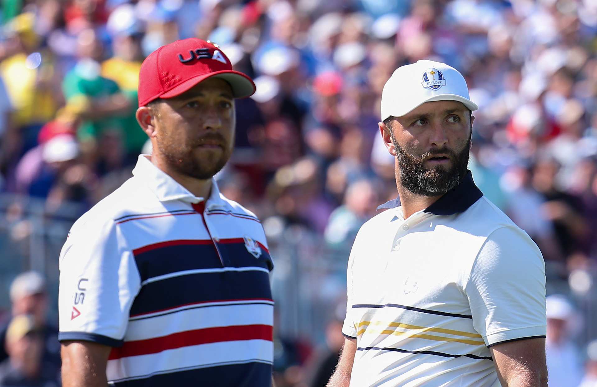 FARMINGDALE, NEW YORK - SEPTEMBER 28: (L-R) Xander Schauffele of Team United States and Jon Rahm of Team Europe look on from the first tee during the Sunday singles matches of the 2025 Ryder Cup at Black Course at Bethpage State Park Golf Course on September 28, 2025 in Farmingdale, New York. (Photo by Andrew Redington/Getty Images)